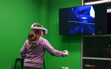 A youngster testing out the virtual reality headsets